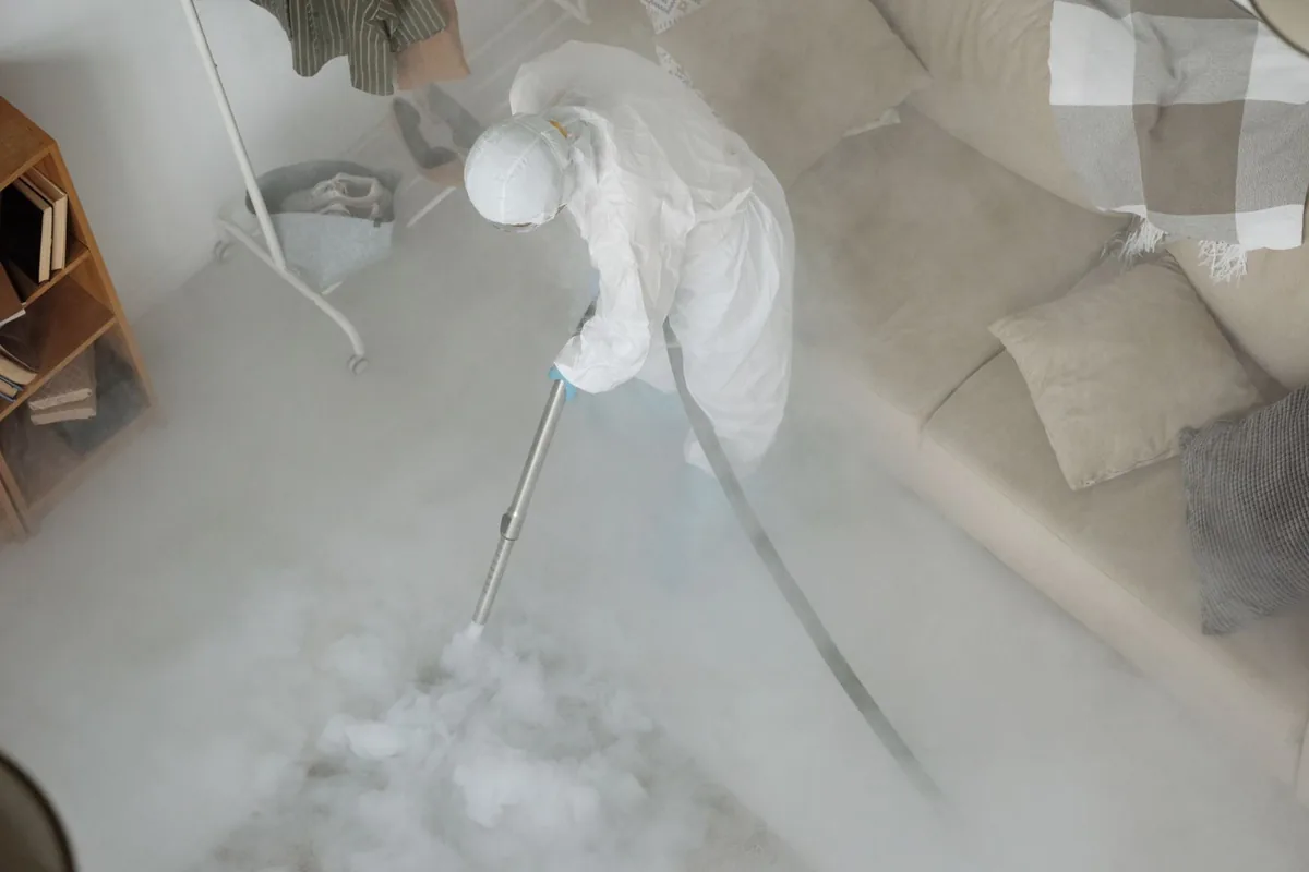 Biohazard cleanup technician in protective equipment, Lebanon, MO